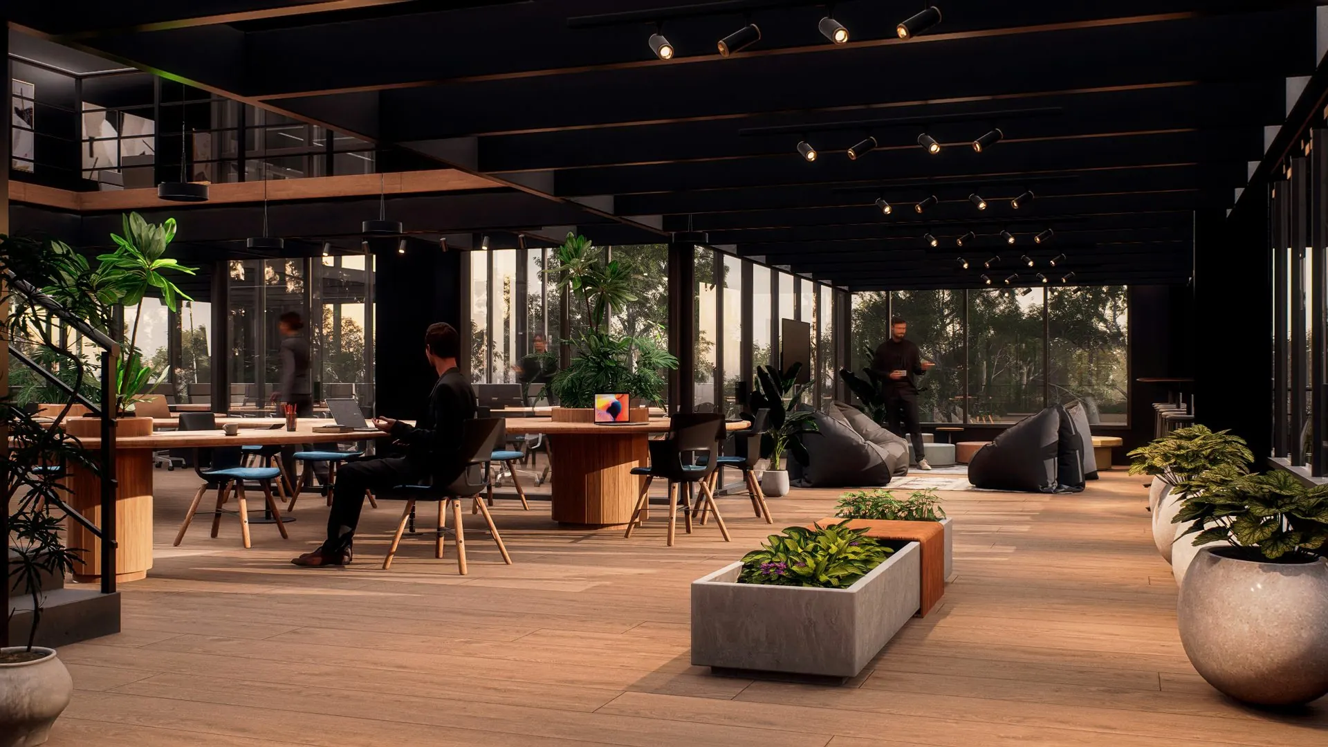 Cowork con mesas de trabajo y vegetación